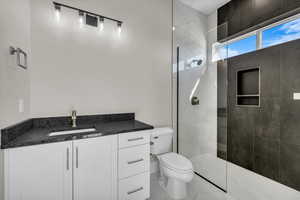 Full bathroom featuring vanity and a walk in shower