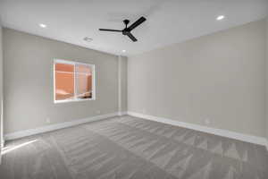 Spare room with recessed lighting, light carpet, and ceiling fan