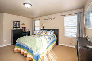Carpeted bedroom with baseboards