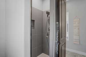 Full bathroom featuring a stall shower