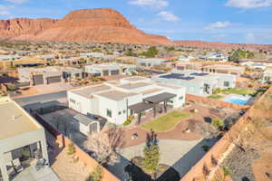 Aerial view of residential area featuring a mountainous background