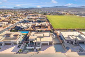 Aerial view of residential area featuring a mountainous background