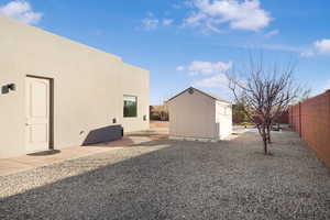 Fenced backyard with a shed