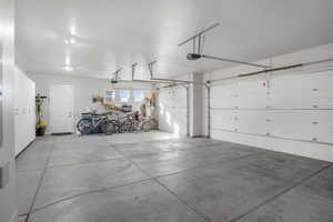 Garage featuring a garage door opener