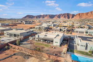 Aerial perspective of suburban area with a mountain backdrop