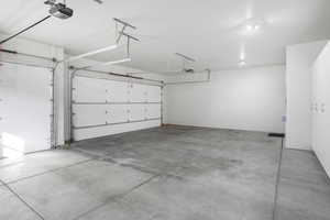 Garage featuring a garage door opener