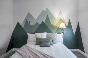 Carpeted bedroom with baseboards