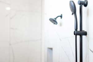 Bathroom view of a marble finish shower