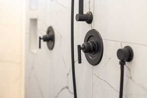 Bathroom view of a marble finish shower