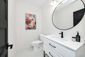 Bathroom featuring vanity and light tile patterned flooring