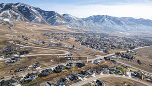 Aerial perspective of suburban area featuring a mountain backdrop