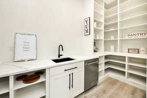 Pantry featuring a sink