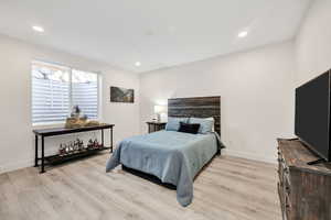 Bedroom featuring light wood finished floors and recessed lighting