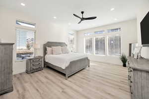 Bedroom featuring ceiling fan, light wood-type flooring, and recessed lighting