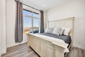 Bedroom featuring light wood-type flooring and recessed lighting