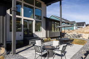 View of patio / terrace featuring an outdoor fire pit and outdoor dining space