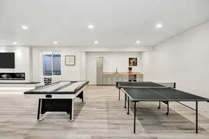 Recreation room featuring recessed lighting and light wood-style floors
