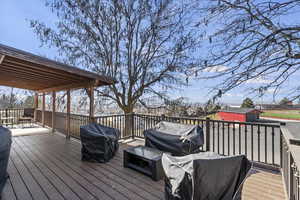 Deck featuring a grill