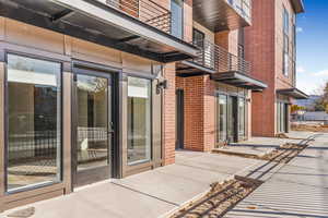 Photo of finished unit - Entrance to property featuring brick siding