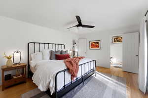 Bedroom featuring light wood finished floors and a ceiling fan