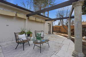 Fenced backyard with a patio area