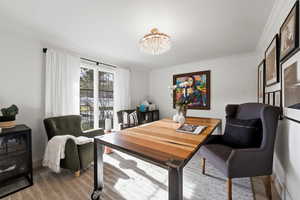 Office featuring a chandelier and ornamental molding
