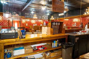 Miscellaneous room featuring wallpapered walls and ceiling fan