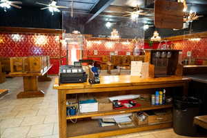 Miscellaneous room featuring a ceiling fan