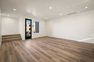 Unfurnished room featuring recessed lighting and wood finished floors