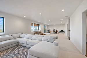 Living room featuring recessed lighting and carpet flooring