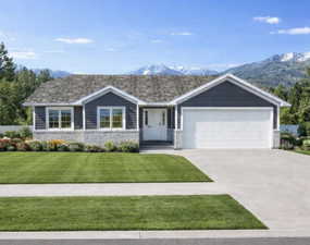 Ranch-style house with stone siding, a mountain view, concrete driveway, and a garage