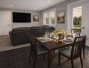 Dining area with recessed lighting and dark tile patterned flooring