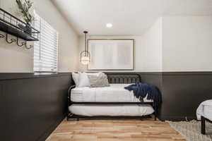 Bedroom featuring wood finished floors and recessed lighting