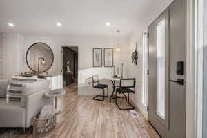 Interior space with light wood-style flooring and recessed lighting