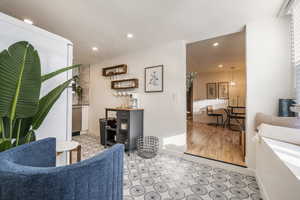 Living room with recessed lighting and light floors