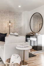 Living room with wood finished floors and recessed lighting