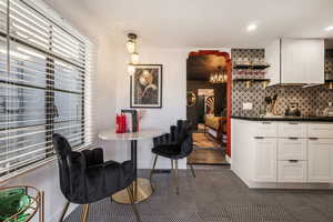 Dining area featuring hanging lights and baseboards