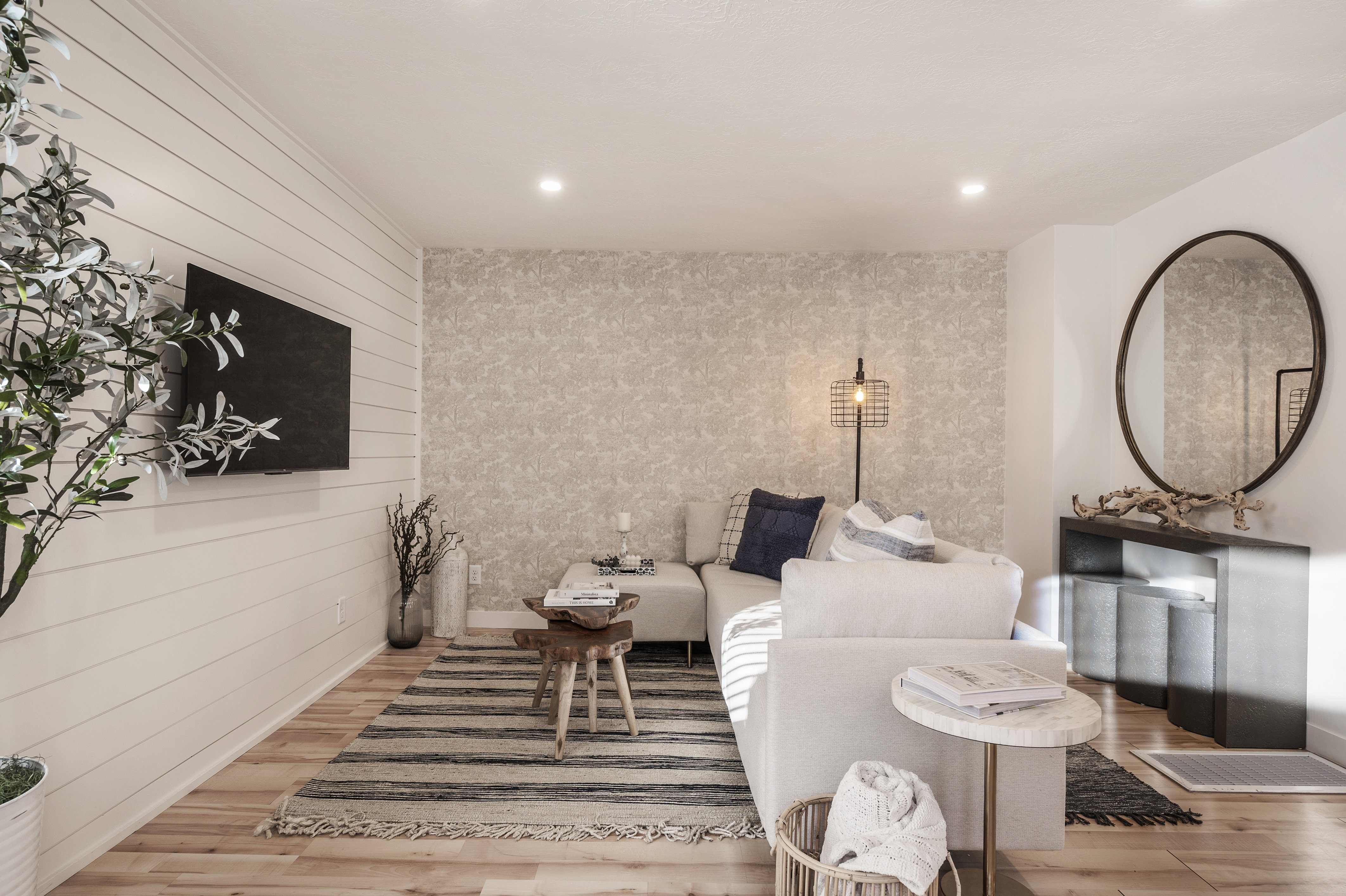 Living area with wood finished floors and recessed lighting