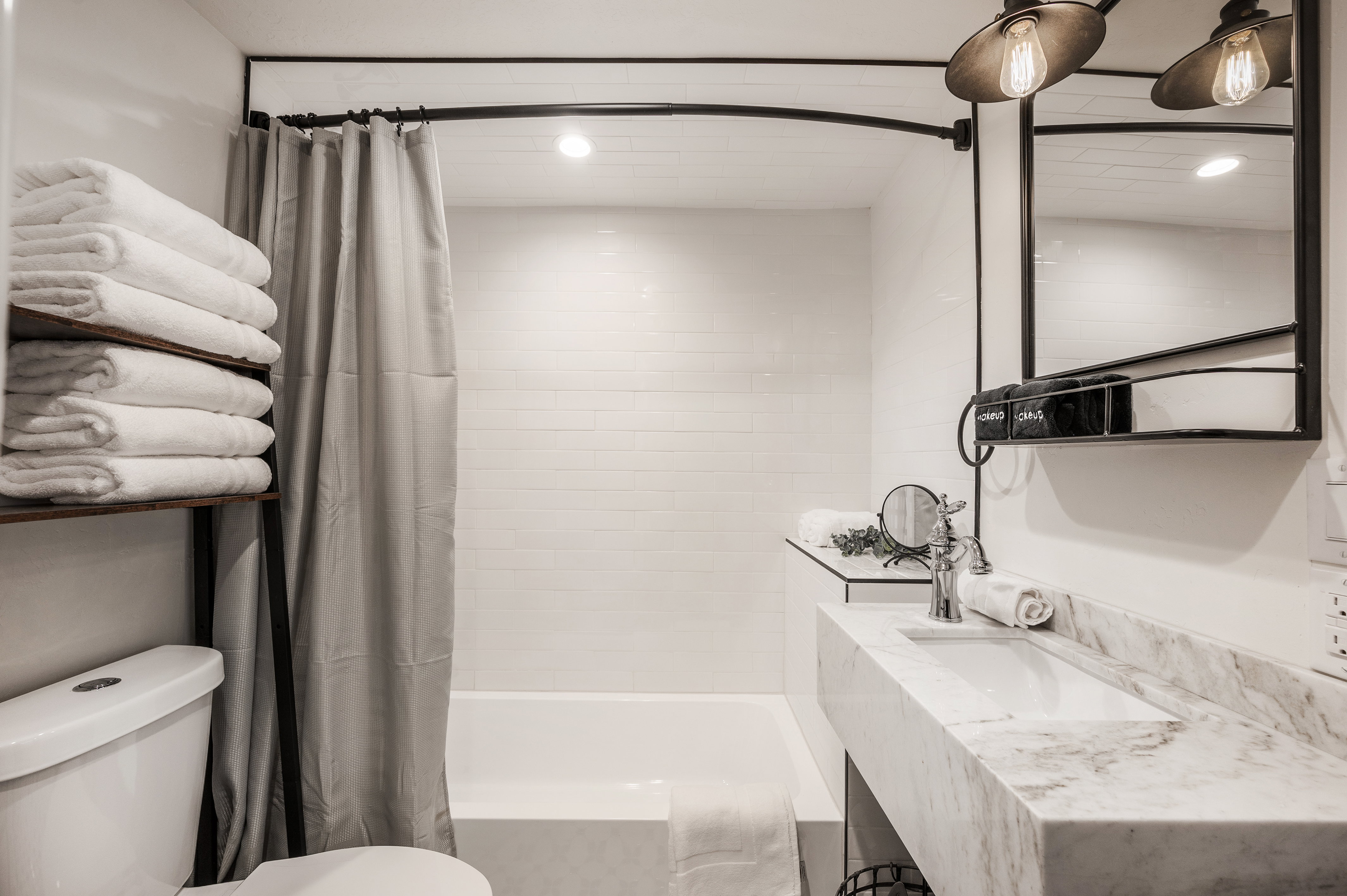 Full bathroom with shower / bath combo and vanity