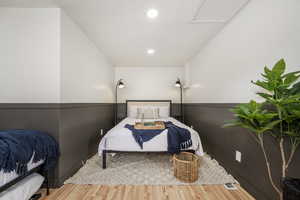 Bedroom featuring wood finished floors and recessed lighting