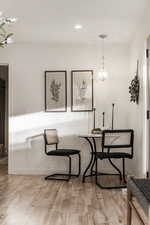 Dining area featuring light wood finished floors and recessed lighting