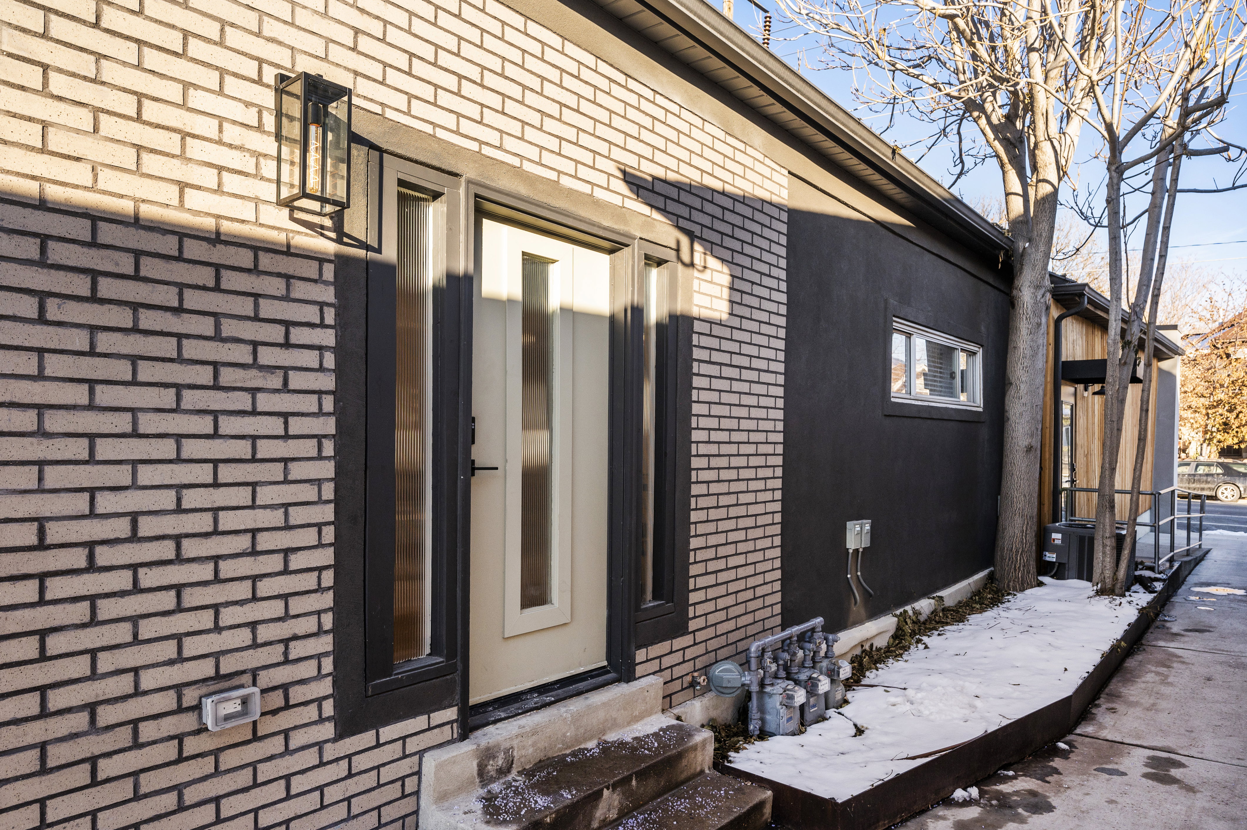 View of home's exterior with brick siding and entry steps