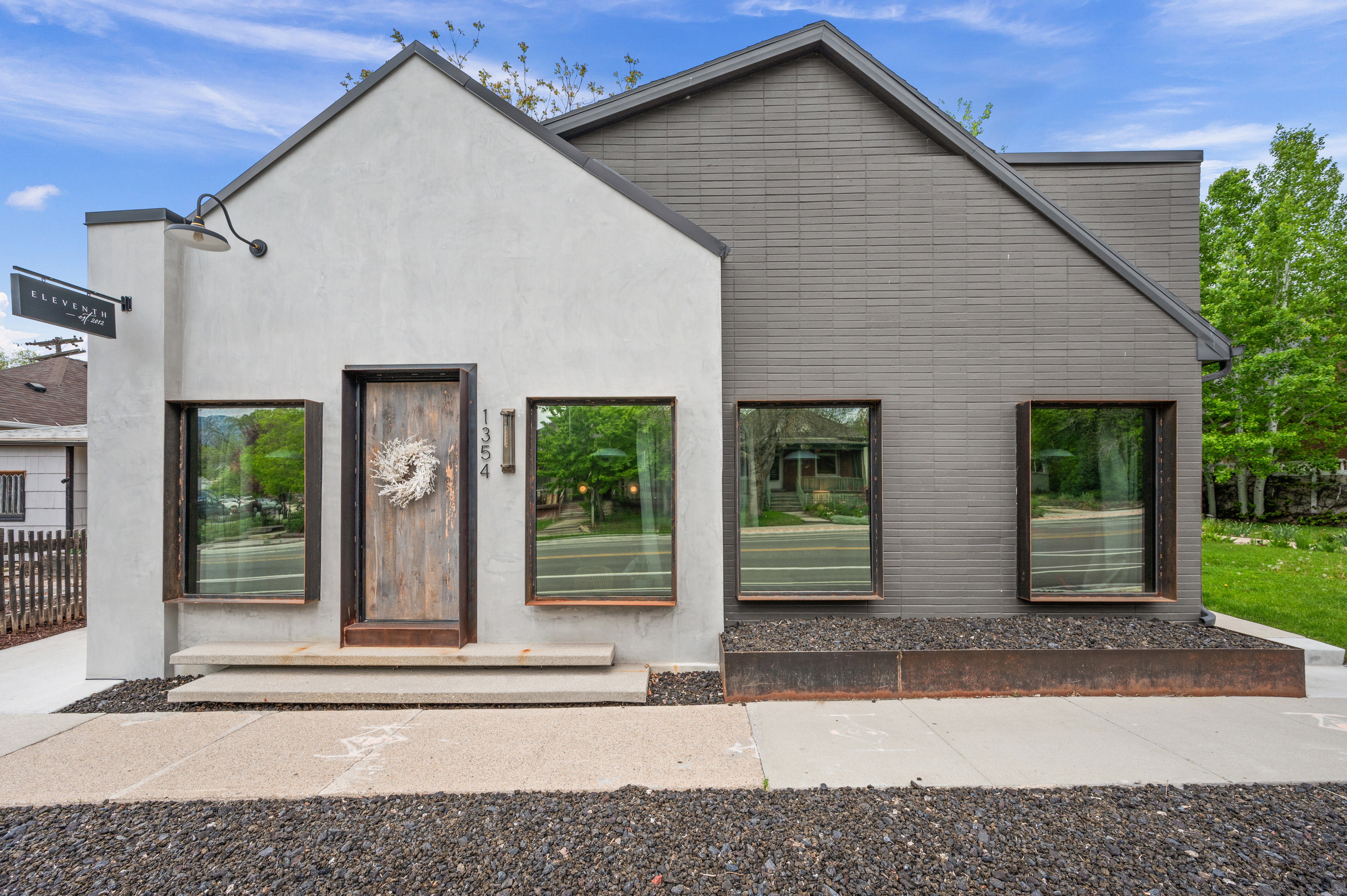 Rear view of house featuring stucco siding