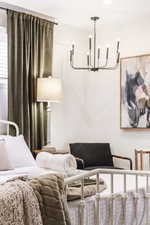 Bedroom with a chandelier