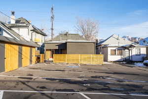 View of front of house featuring uncovered parking and stucco siding