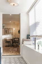 Corridor with recessed lighting and light wood-style floors