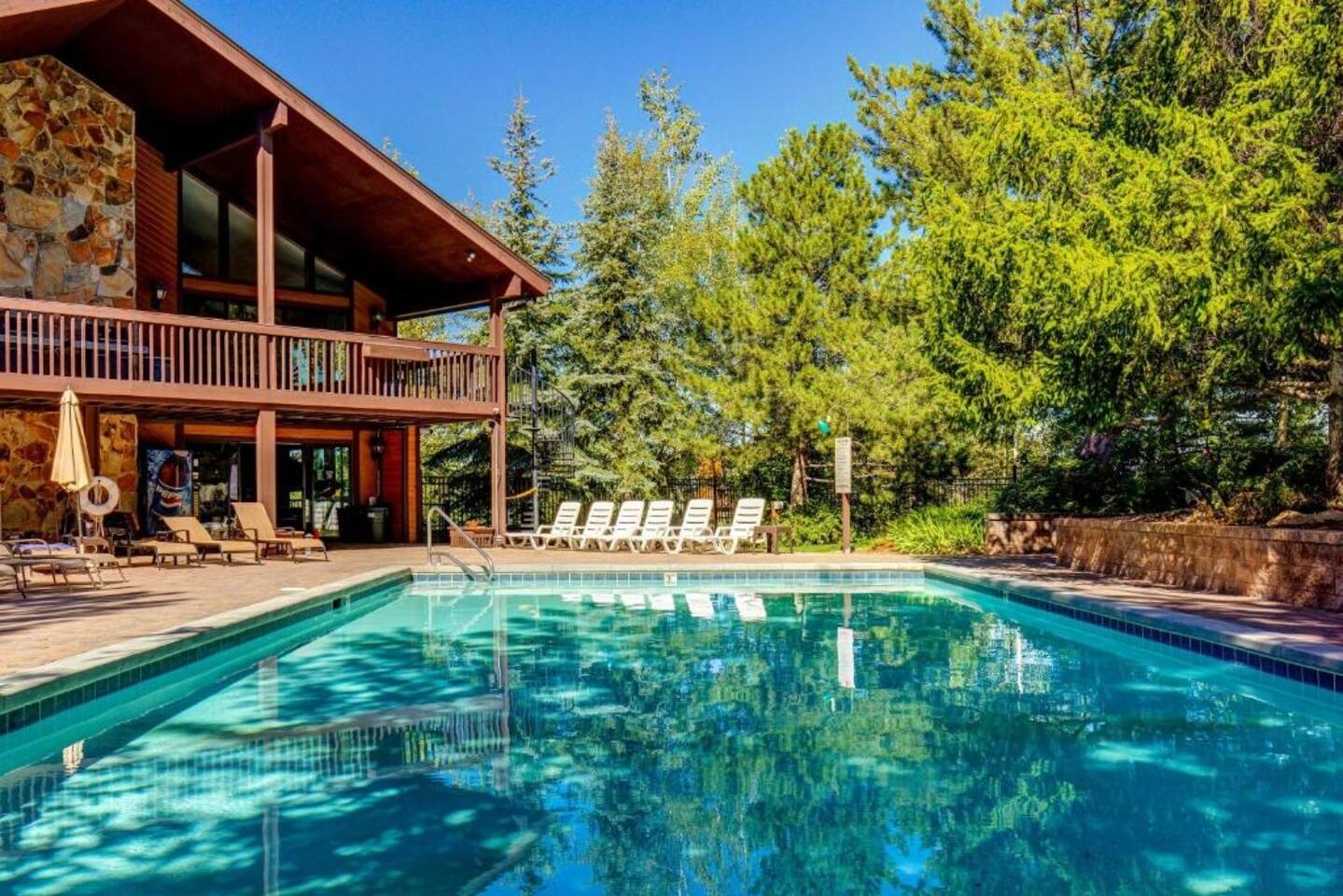 Community pool with a patio area