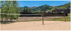 View of community with volleyball court and a mountain view