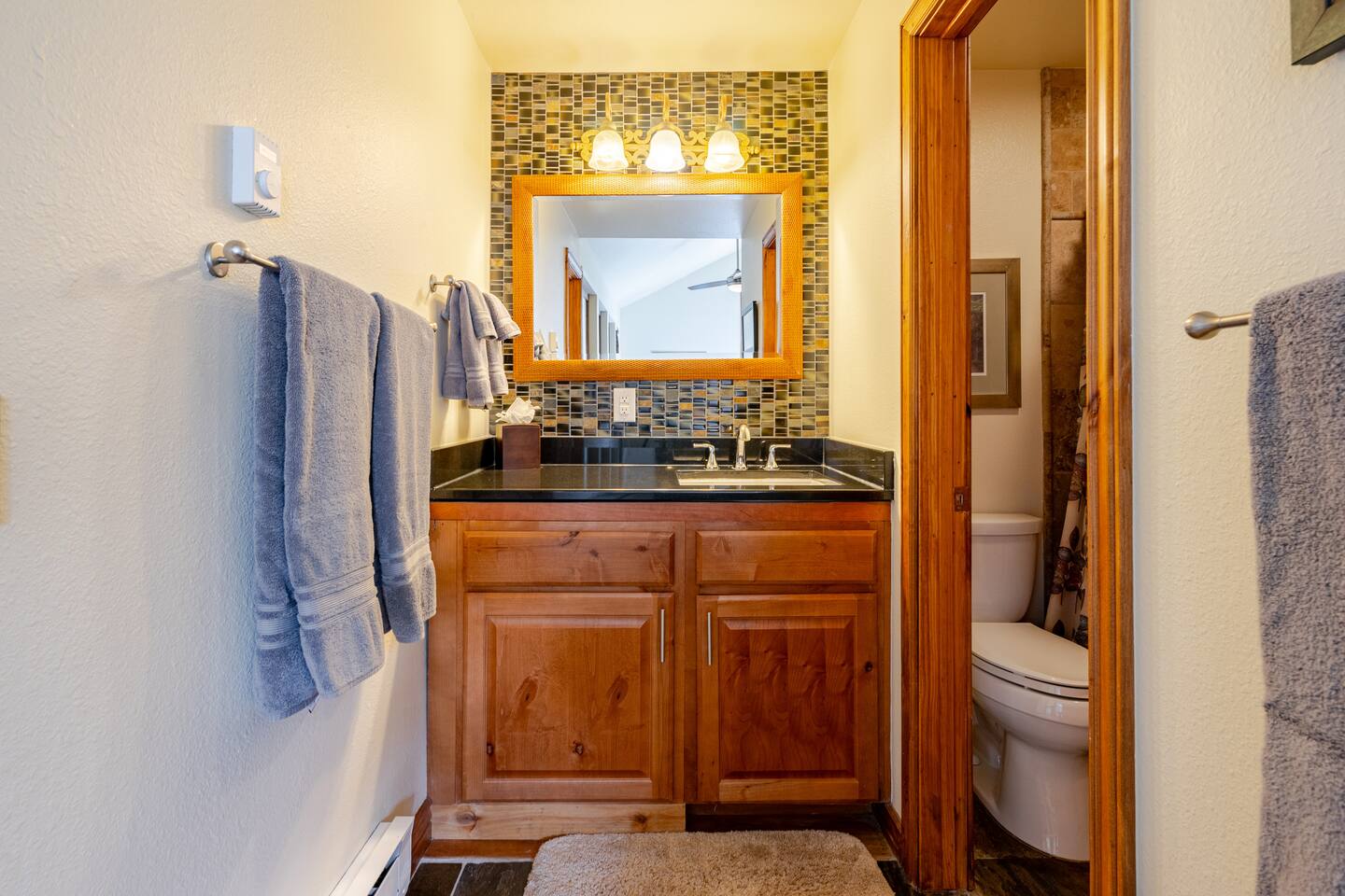Second level full bathroom.  Second water heater under the vanity