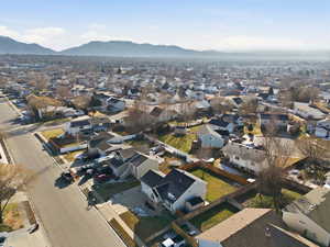 Aerial perspective of suburban area featuring a mountainous background